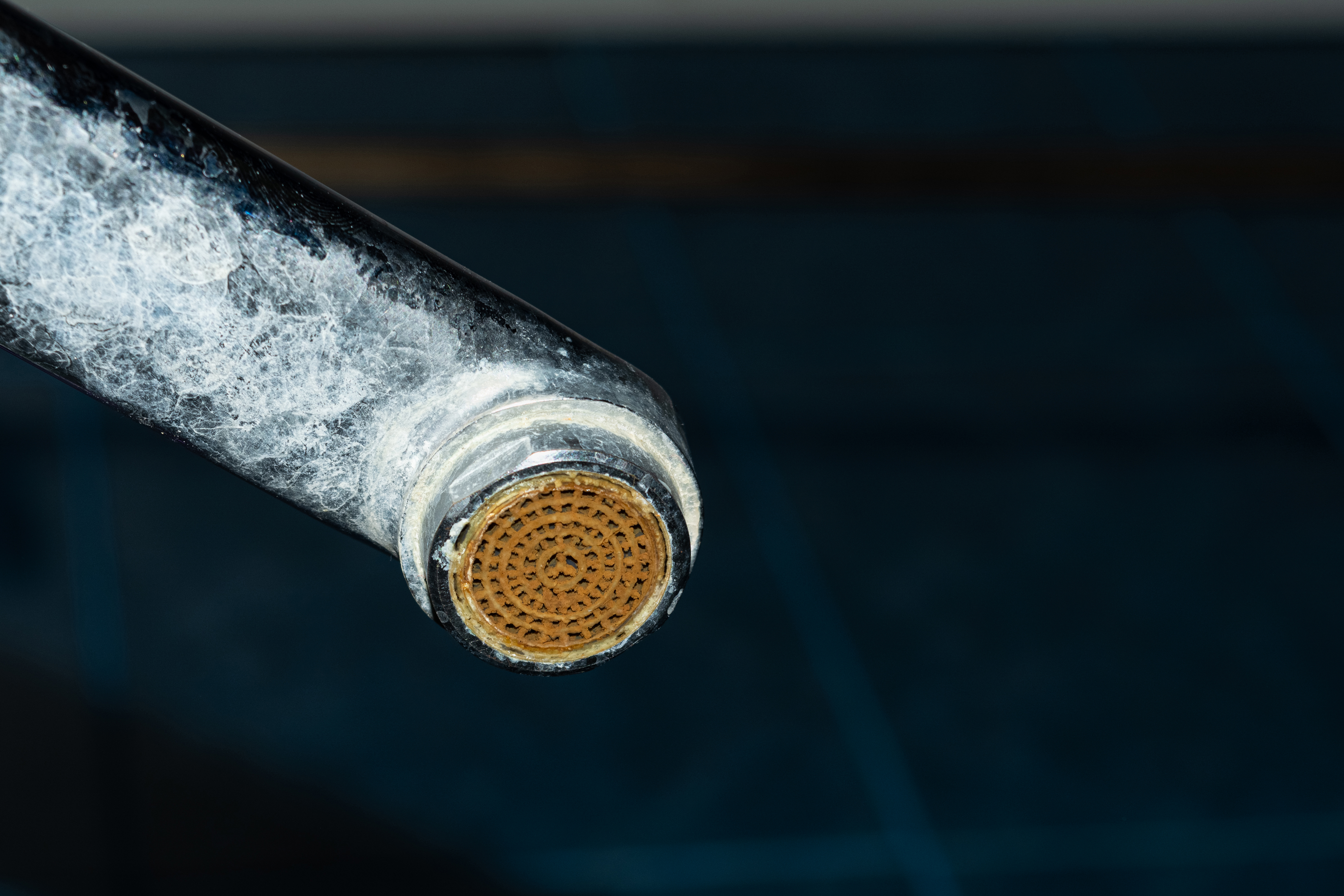 Heavy limescale and mineral buildup on a Phoenix faucet from very hard water at ~16 GPG (275 ppm)